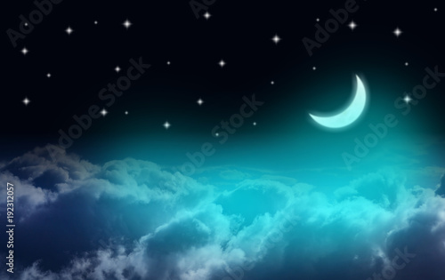 Crescent moon over clouds in a starry night