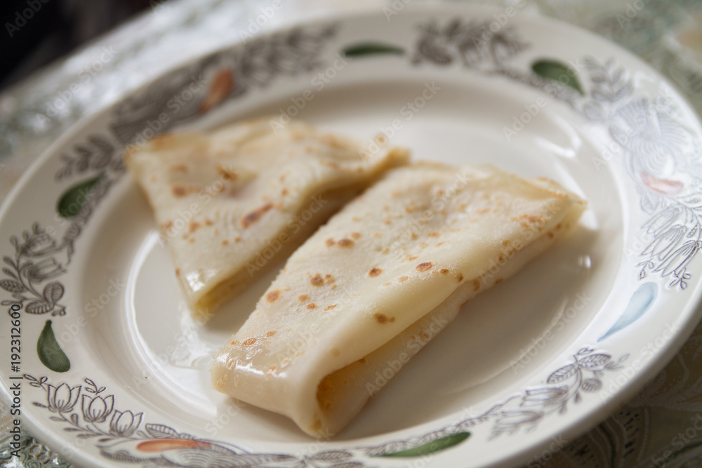 a fresh baked pancake on a plate a fresh baked pancake on a plate