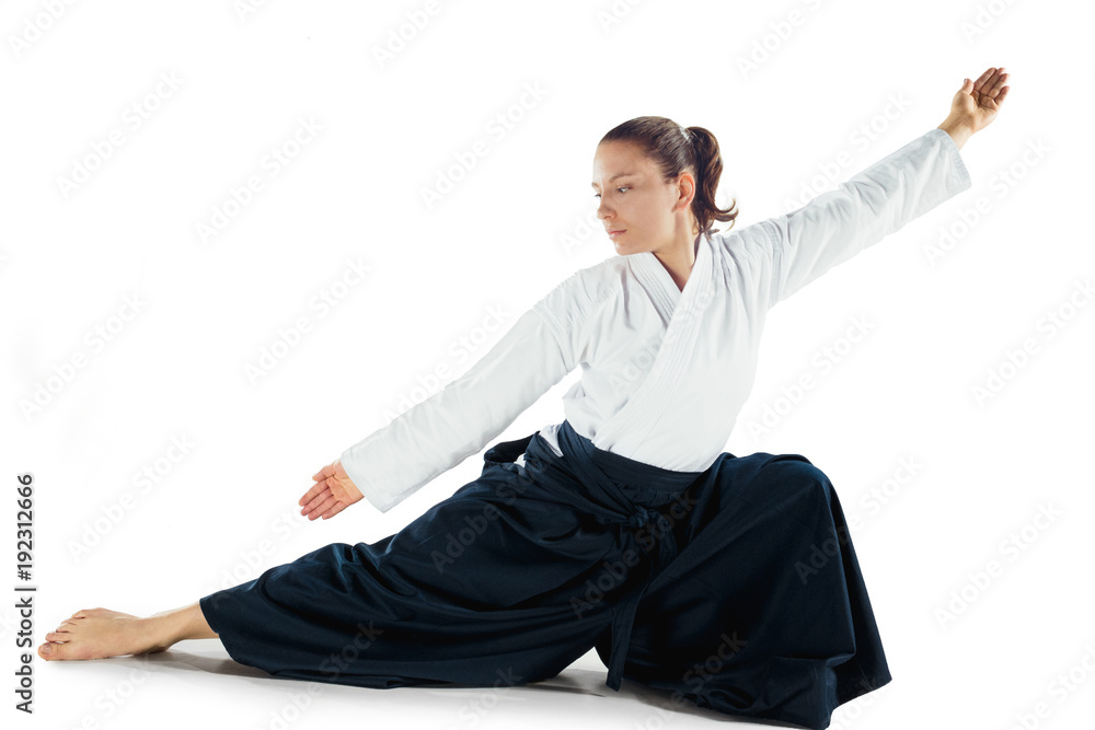 Aikido master practices defense posture. Healthy lifestyle and sports  concept. Woman in white kimono on white background. Stock Photo | Adobe  Stock