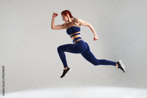woman in blue sportswear running