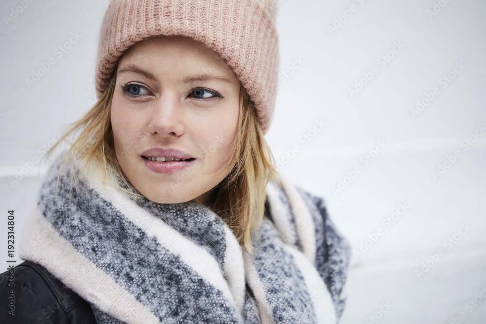 Beautiful young woman in winter clothing, looking away Beautiful young woman in winter clothing, looking away