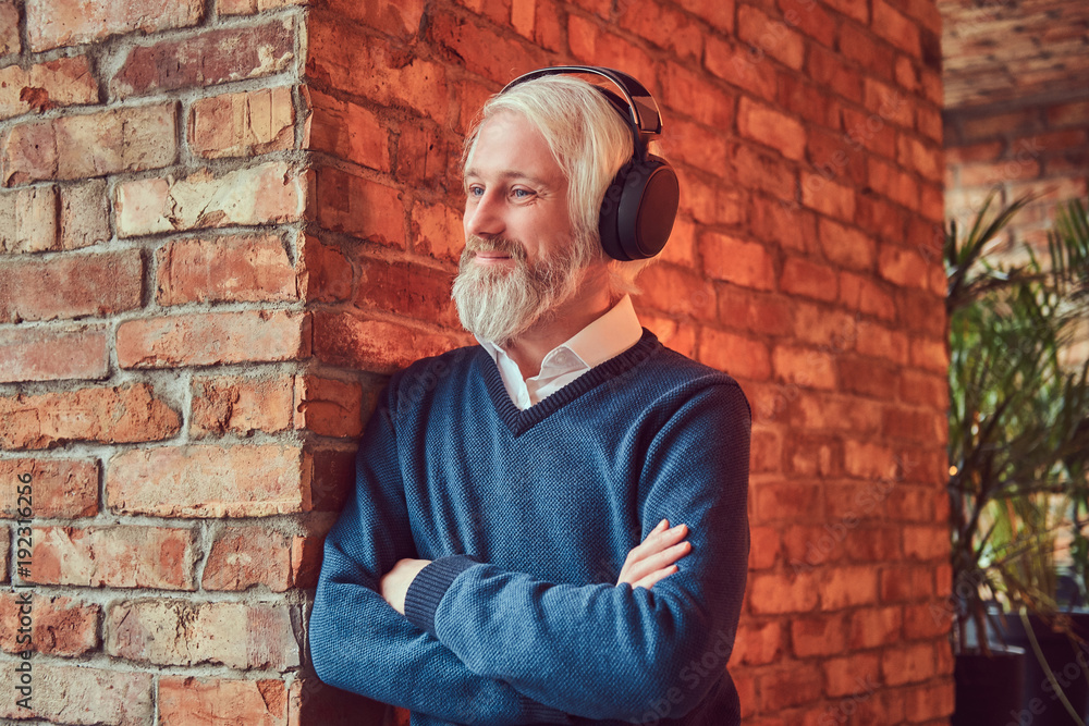 Portrait of an old man with a gray beard. Portrait of an old man with a gray beard.