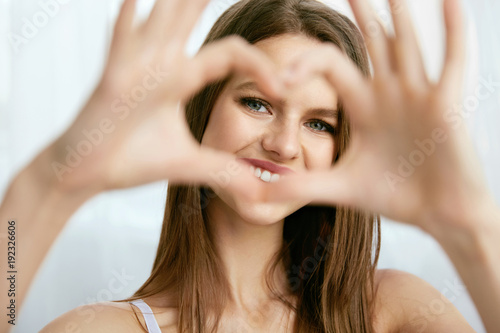 Beautiful Girl Showing Heart With Hands