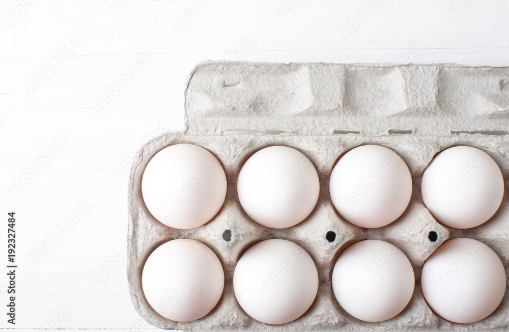 Chicken eggs on a wooden kitchen table. Chicken eggs on a wooden kitchen table.