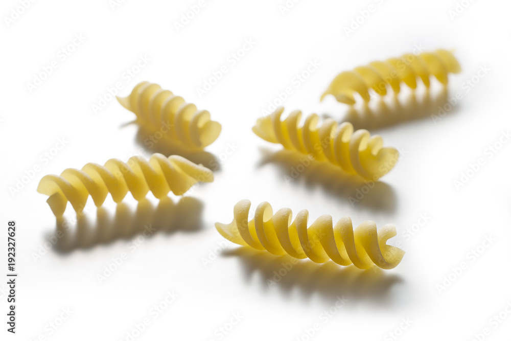 Fototapeta premium Five pieces of Fusilli pasta isolated on white background
