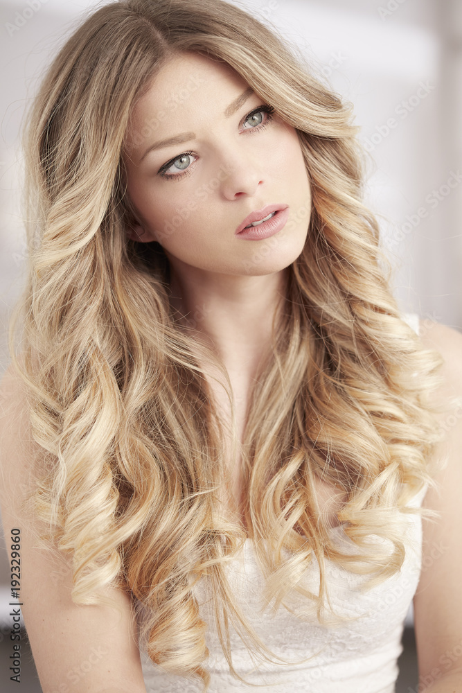 blonde girl with long curl hair and blue eyes portrait blonde girl with long curl hair and blue eyes portrait