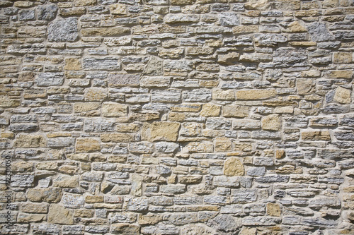 Old stone wall made of limestone and sandstone