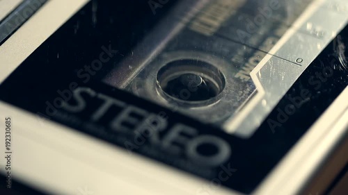 Retro music tape with cassette spinning. photo