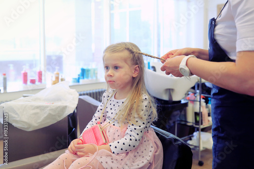 Little girl in barbershop