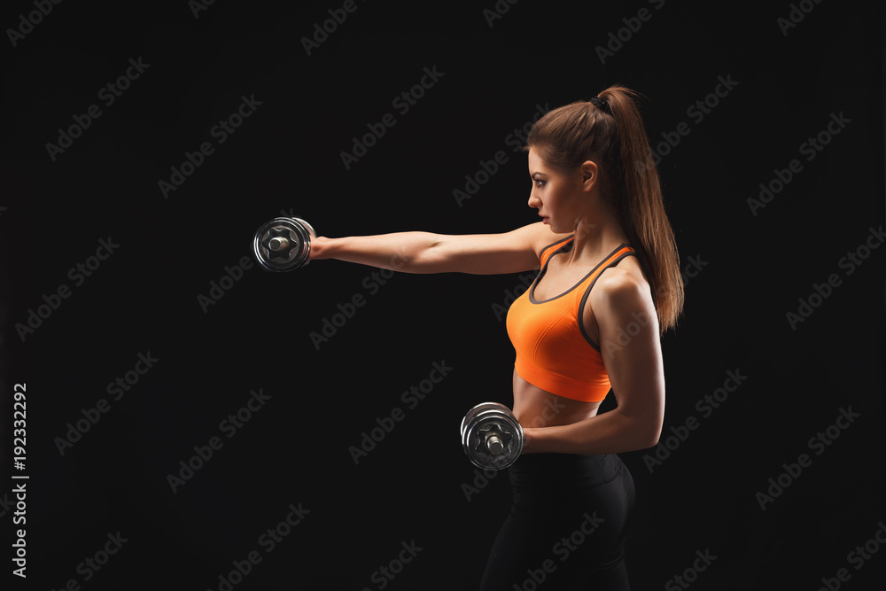 Athletic woman with dumbbells Athletic woman with dumbbells