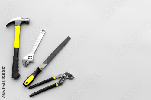 Repair tools. File, hummer on grey background top view copy space pattern