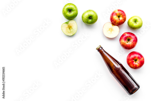 Apple cider. Low-alcoholic beveradge in dark bottle on white background top view copy space photo