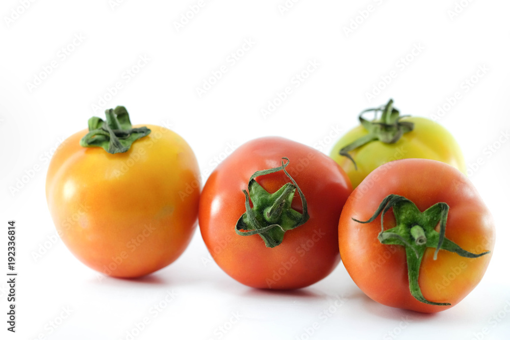 Close up of tomatoes in green and red version with isolate use as texture and background for food concept Close up of tomatoes in green and red version with isolate use as texture and background for food concept
