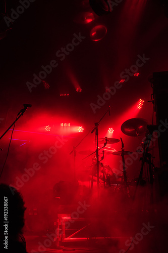 Guitar in the hands of a musician on a rock concert music