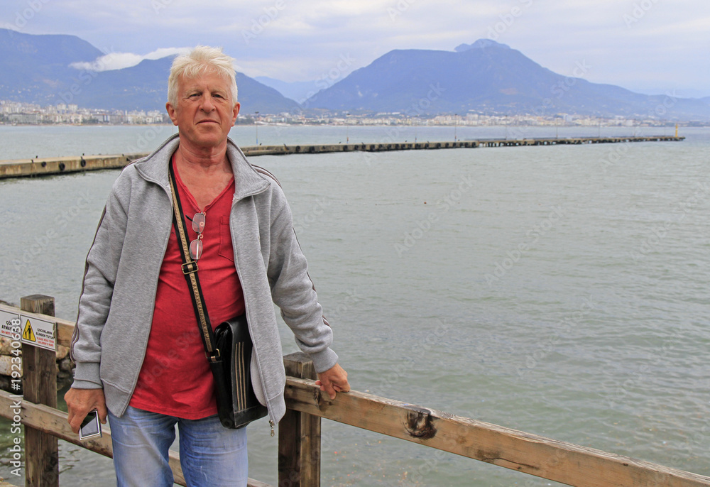 russian tourist against the background of Alanya harbour