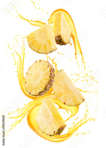pineapple slices in juice splash isolated on a white background