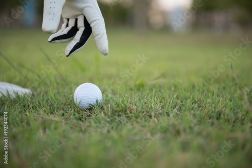 Close up hand of golfer put golf from grass,Thailand people