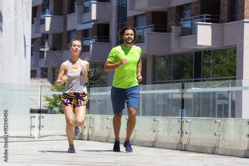Couple running in urban env...