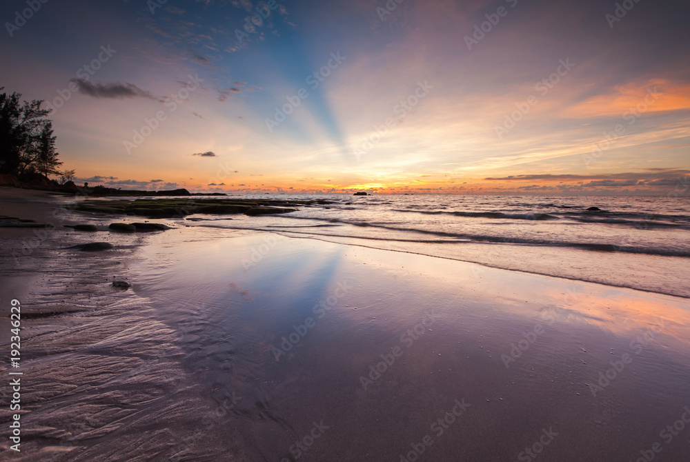 seascape with ray of light and reflection. image contain soft focus and blur due to long expose.