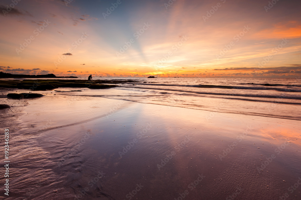 seascape with ray of light and reflection. image contain soft focus and blur due to long expose.