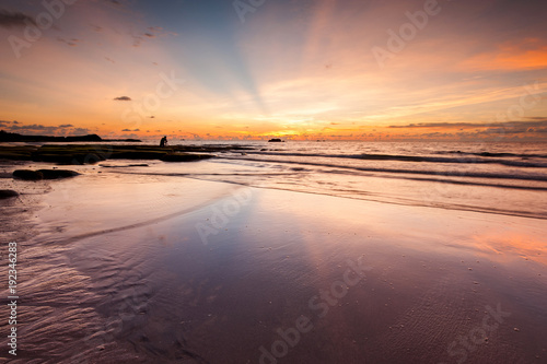 seascape with ray of light and reflection. image contain soft focus and blur due to long expose.