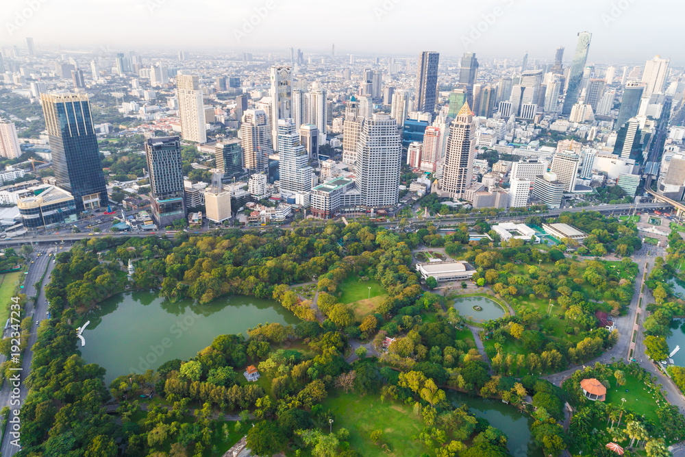 Fototapeta premium Modern city downtown of Bangkok with green public park