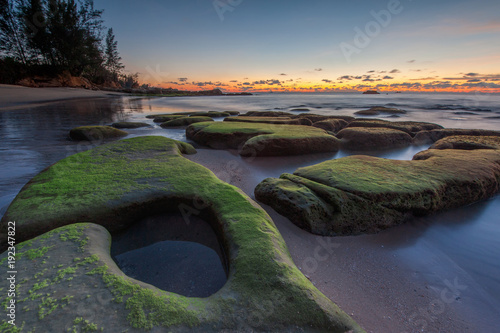 Sunset seascape at Kudat Sabah Malaysia. With natural coastal rocks.