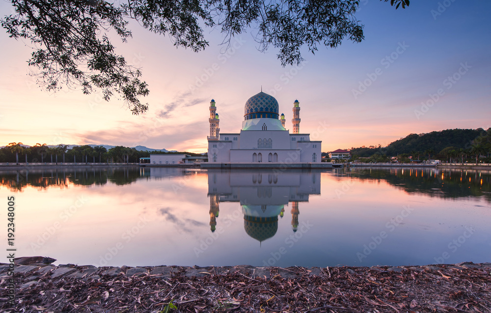 view of beautiful sunrise with reflection at City Mosque, Kota Kinabalu Sabah Malaysia.