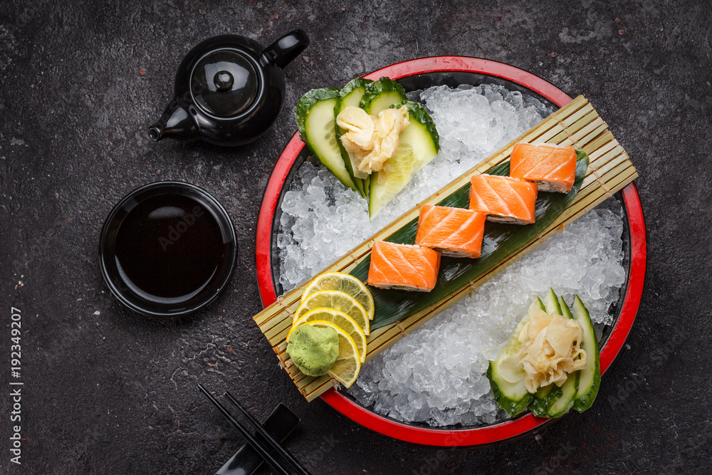 Japanese cuisine. Sushi roll (philadelphia) on ice.