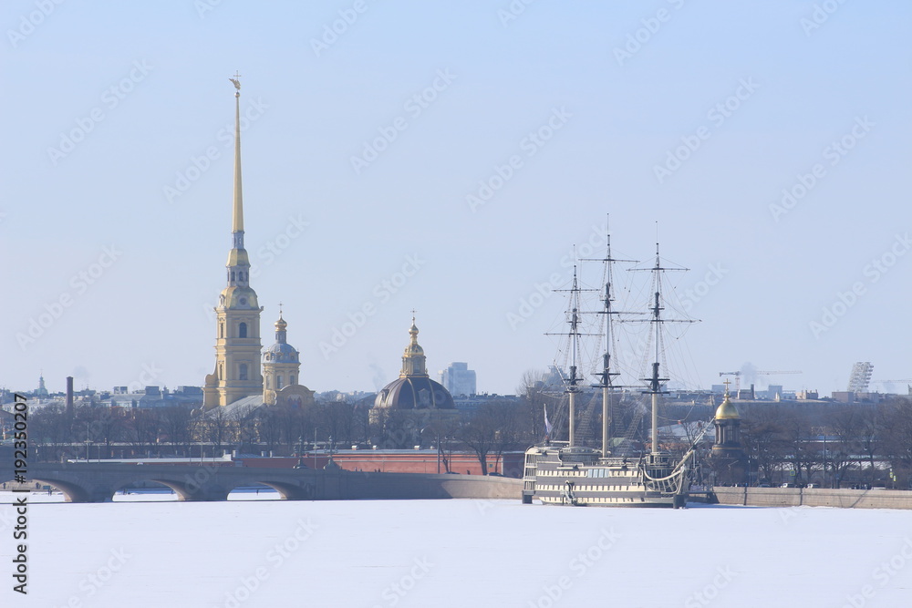 Russia, St. Petersburg, sailboat on the embankment of the river in winter