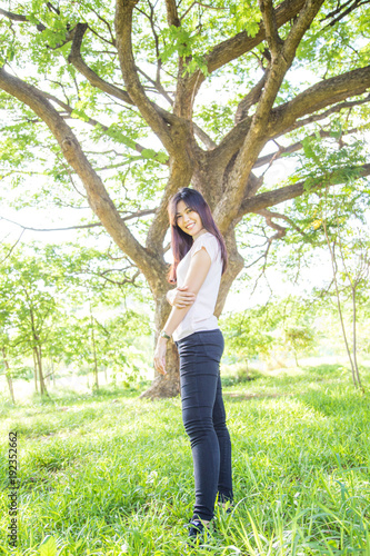 Beautiful women relaxing in green fresh park