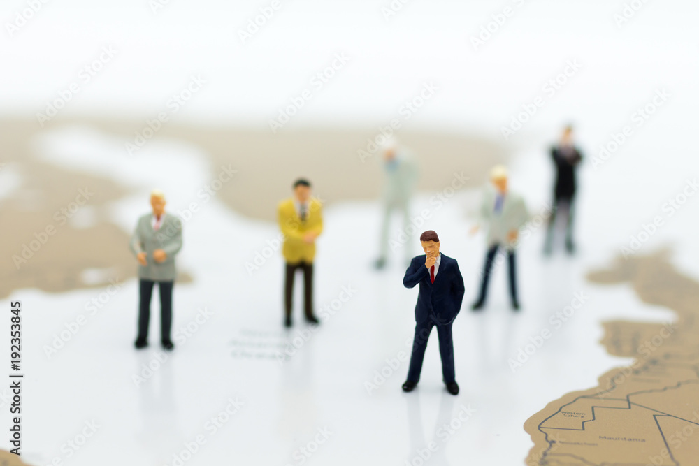 Miniature people: Group businessman negotiates business, planning. Image use for business concept.