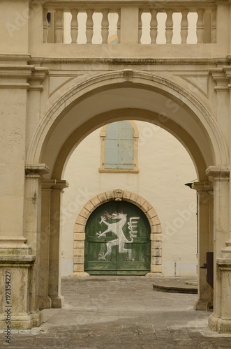 Wooden green door in Landhaus courtyard in Graz, Austria