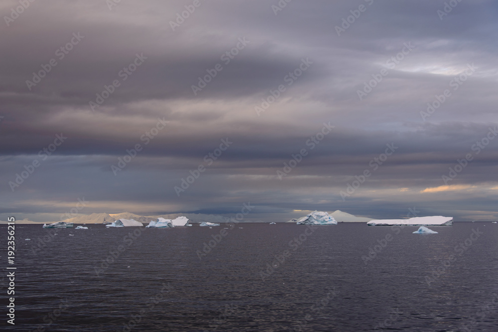 Antarctic landscape with sea and mountains