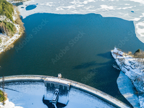 Aerial view of the partially frozen Brucher dam (Bruchertalsperre) near Marienheide in winter. photo