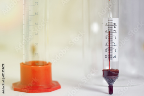 Laboratory thermometer, hydrometer and measuring cylinder photo