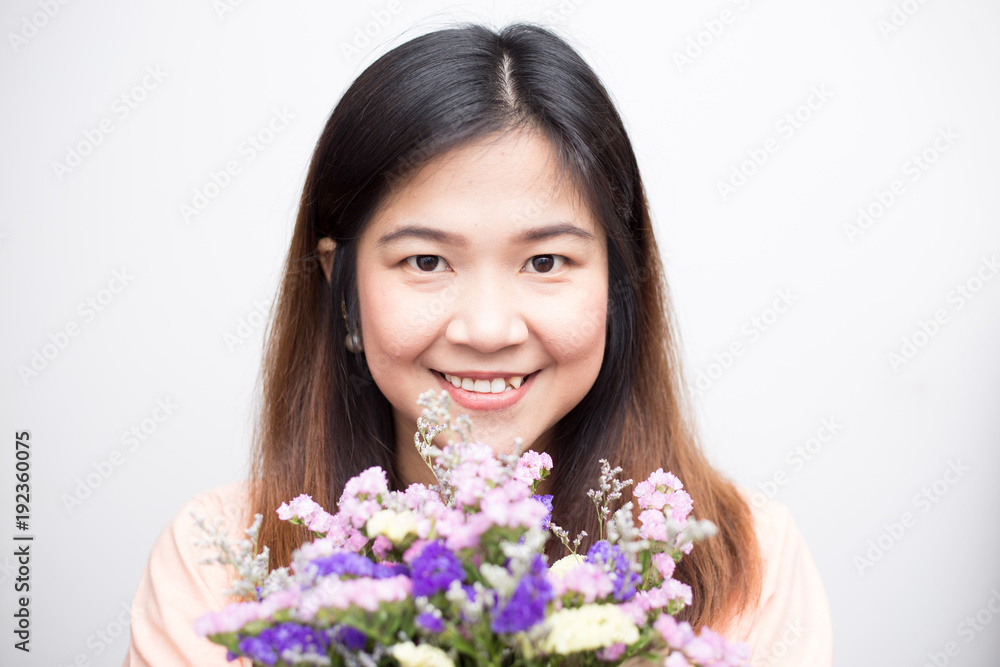 Beautiful asian women with colourful flower bouquet smiling
