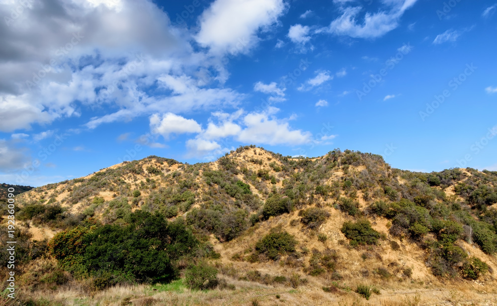 Morning clouds and sun over California hillside