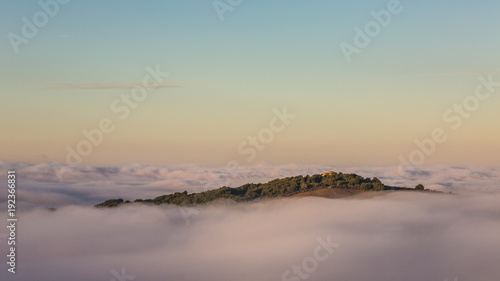 An island above the clouds, Mountain top peaking out of the clouds