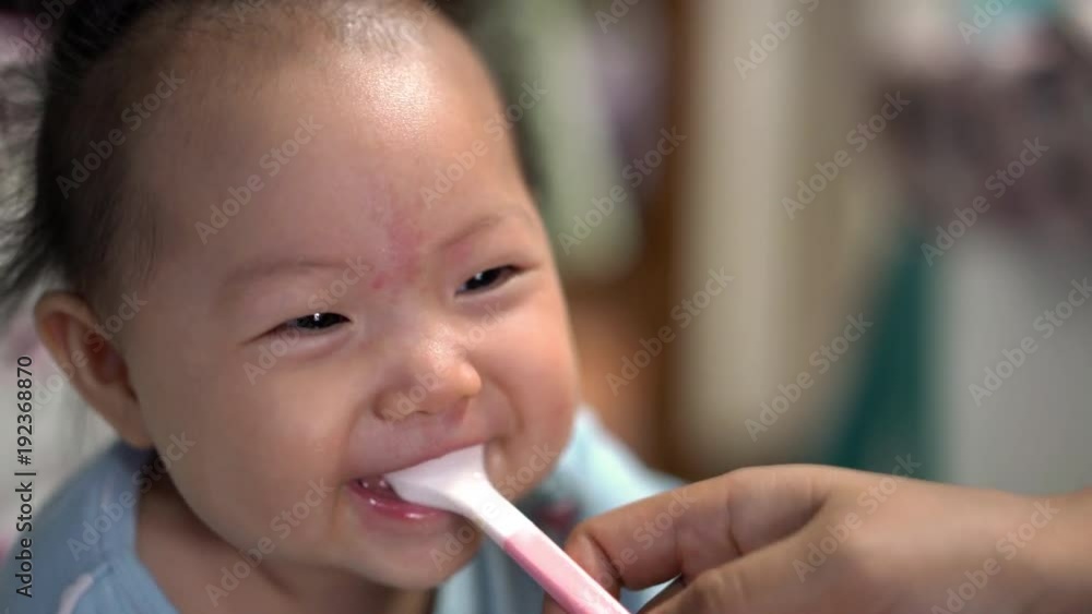 Mom teased her little daughter and baby was laughing and happy. Mom teased her little daughter and baby was laughing and happy.
