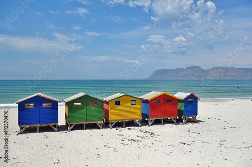 View of the brightly colored Victorian beach cabin houses on the Muizenberg Beach in Cape Town © eqroy