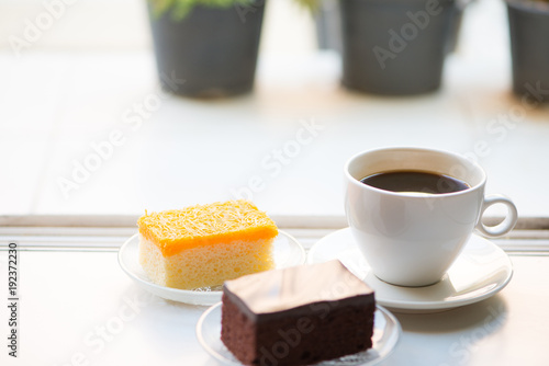 A cup of coffee and Chocolate and golden threads cake