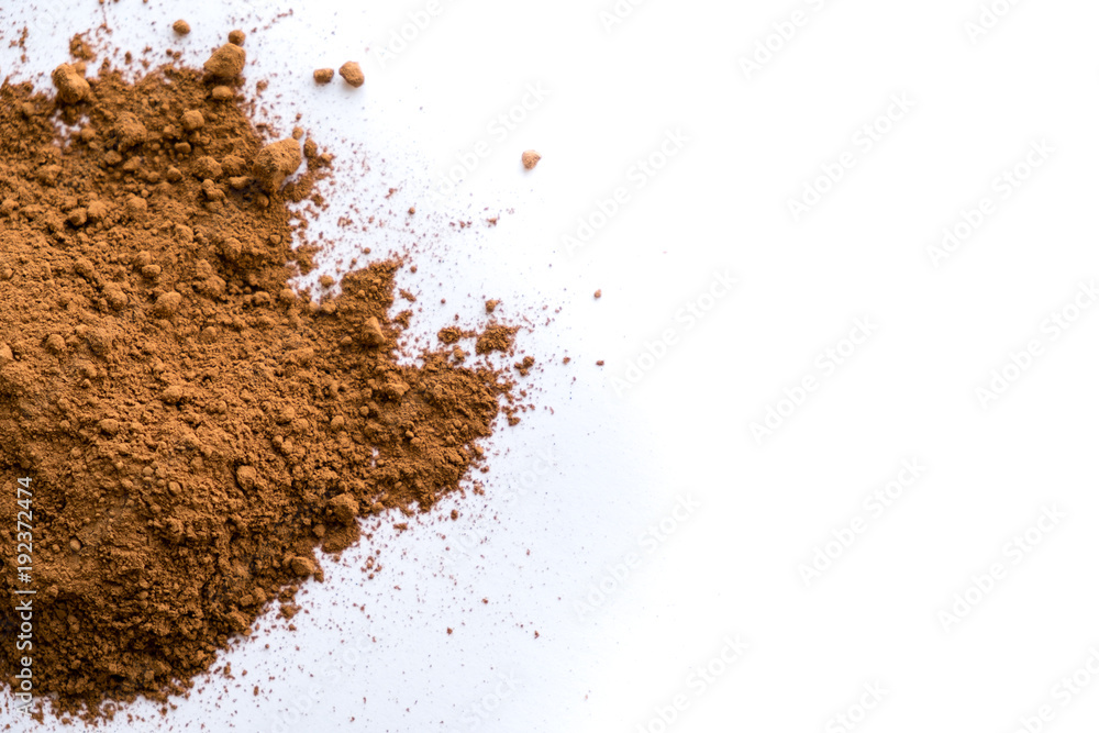 pile cocoa powder in a scoop isolated on white. heap of fresh of chocolate studio shot pile cocoa powder in a scoop isolated on white. heap of fresh of chocolate studio shot