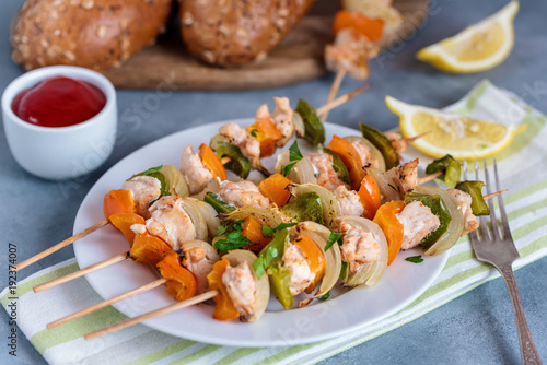 Skewers with chicken, peppers and onions.