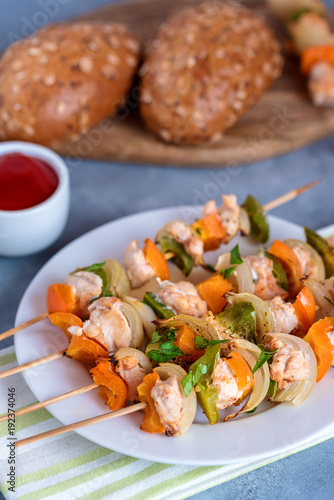 Skewers with chicken, peppers and onions.