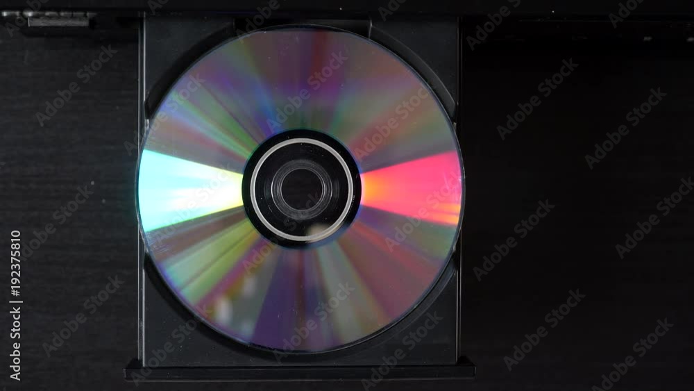 Compact disc, top shot eject (or insert) from CD-player. Compact disc, top shot eject (or insert) from CD-player.