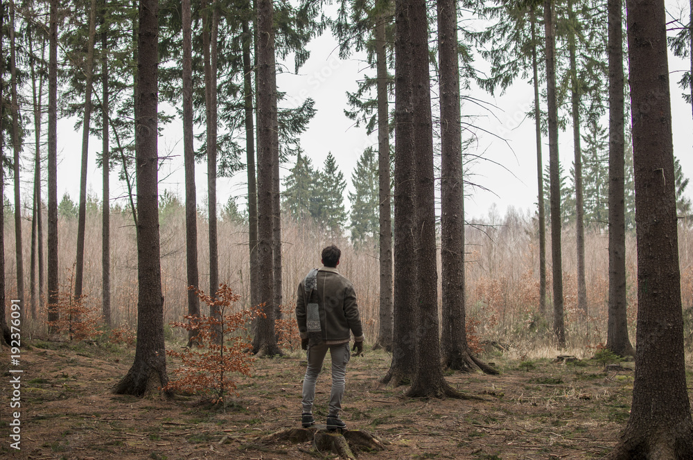 Man standing in the forest Man standing in the forest