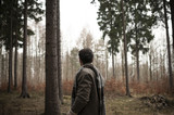 Man standing in the forest
