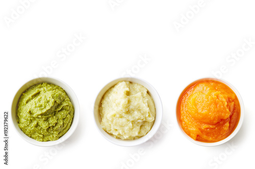 Three bowls of baby puree isolated on white from above