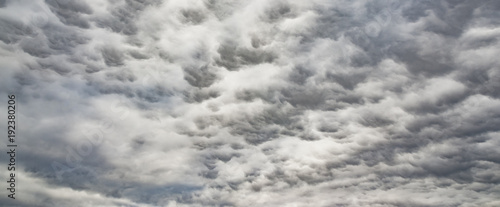 The panorama of overcast texture with clouds. Copy space.A lot of clouds in dramatic filter.